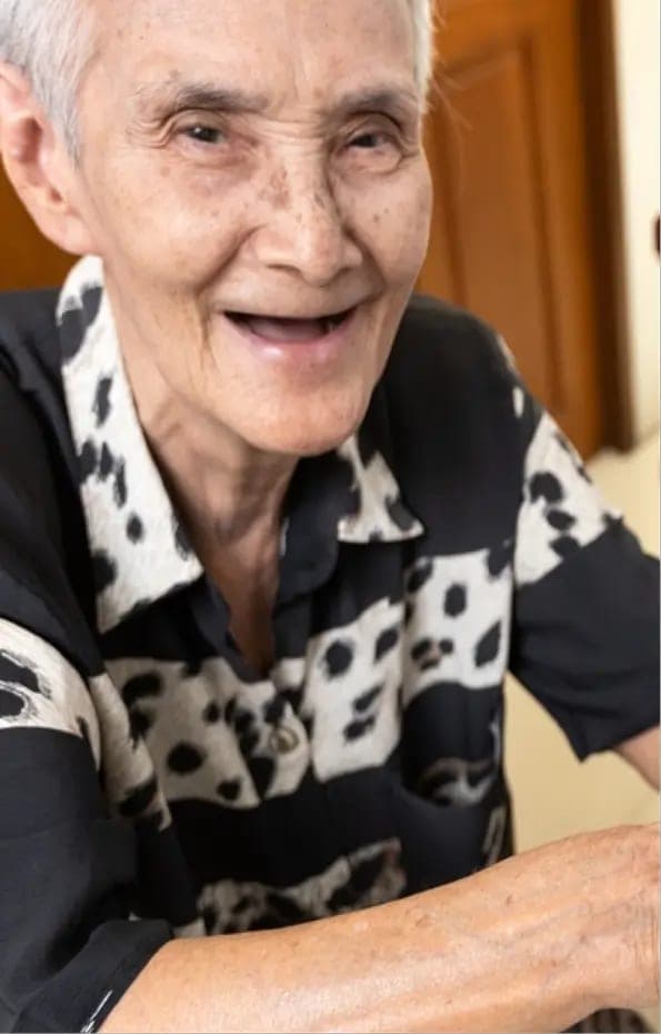 An older patient smiling